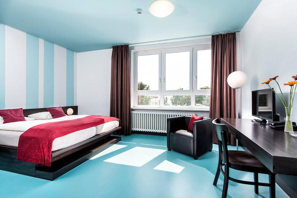 Postel nebo postele na pokoji v ubytování Hotel Grenzfall
