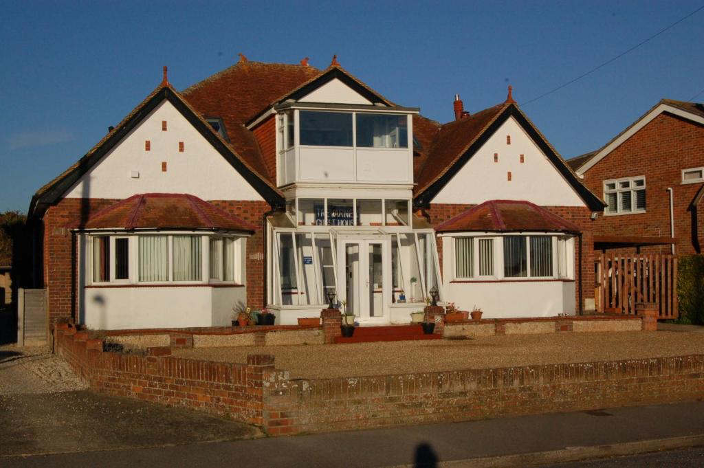 a large house with three roofs at Trevarner Guest House in Fareham