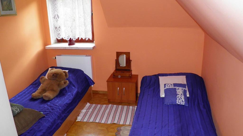Postel nebo postele na pokoji v ubytování Podelniska