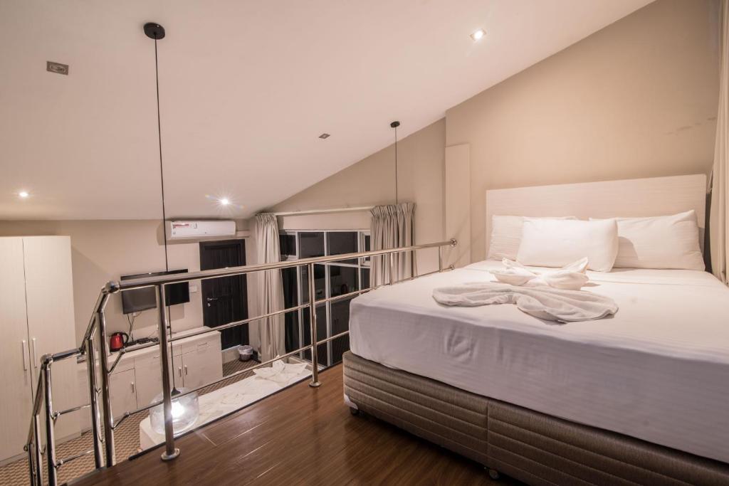 Postel nebo postele na pokoji v ubytování W Residence Kandy
