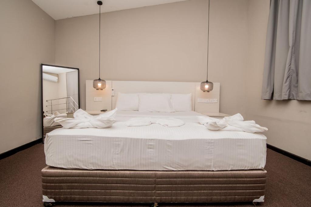 Postel nebo postele na pokoji v ubytování W Residence Kandy