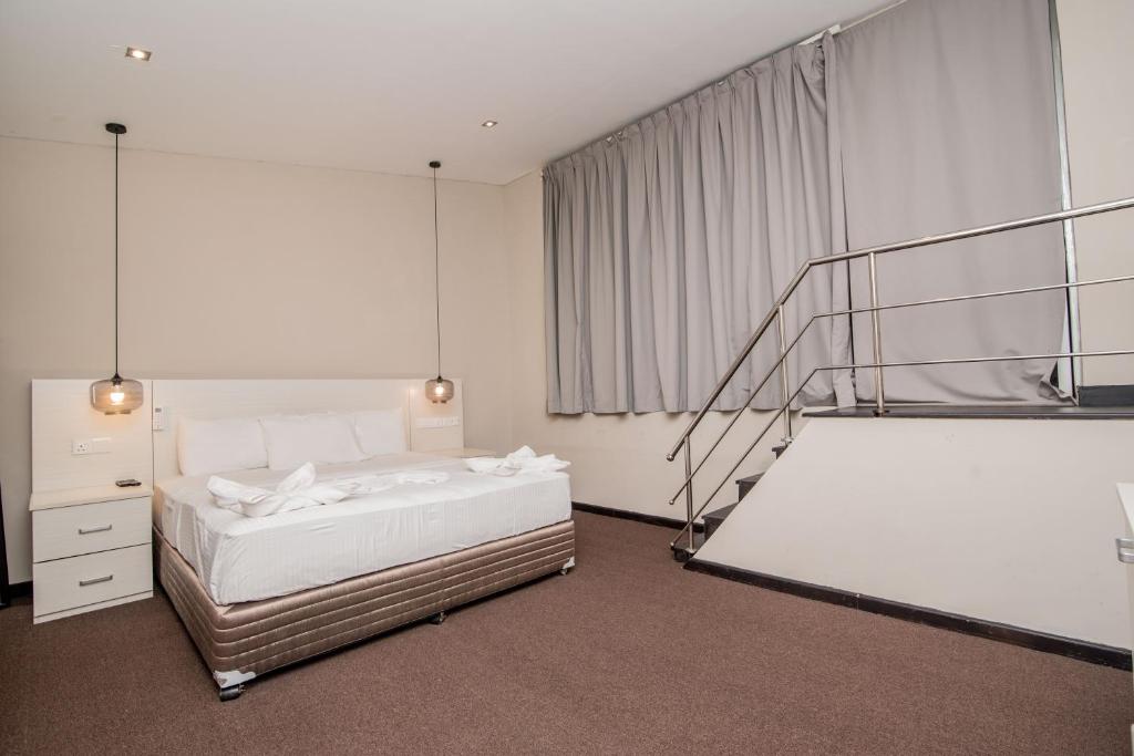 Postel nebo postele na pokoji v ubytování W Residence Kandy