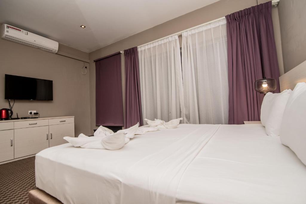 Postel nebo postele na pokoji v ubytování W Residence Kandy