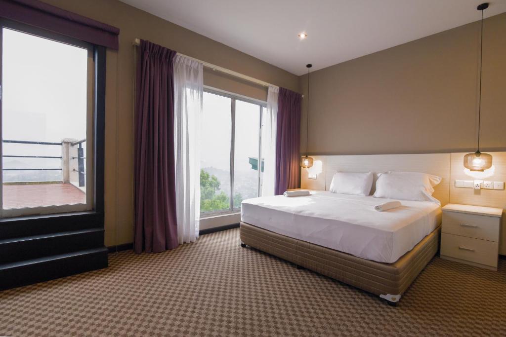 Postel nebo postele na pokoji v ubytování W Residence Kandy