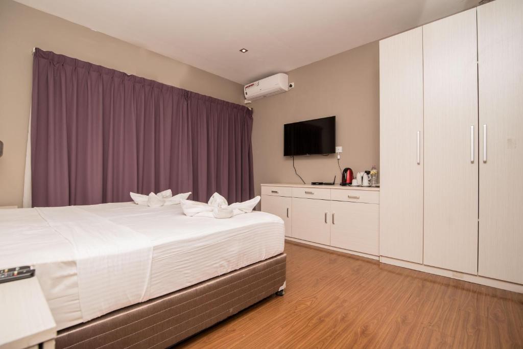 Postel nebo postele na pokoji v ubytování W Residence Kandy