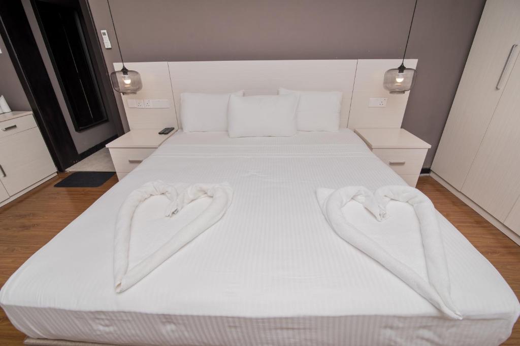 Postel nebo postele na pokoji v ubytování W Residence Kandy