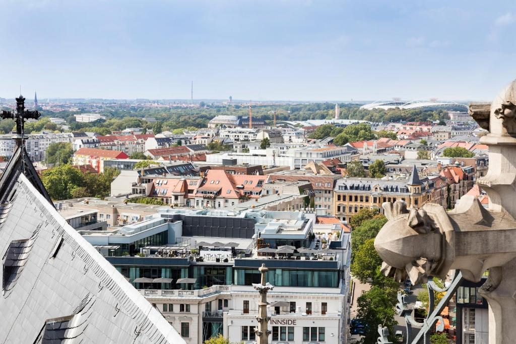 a view of a city from the top of a building at INNSiDE by Meliá Leipzig in Leipzig