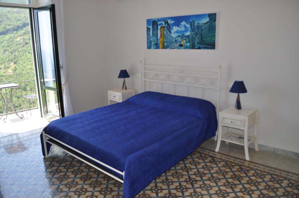 Posteľ alebo postele v izbe v ubytovaní villa verde sul mare
