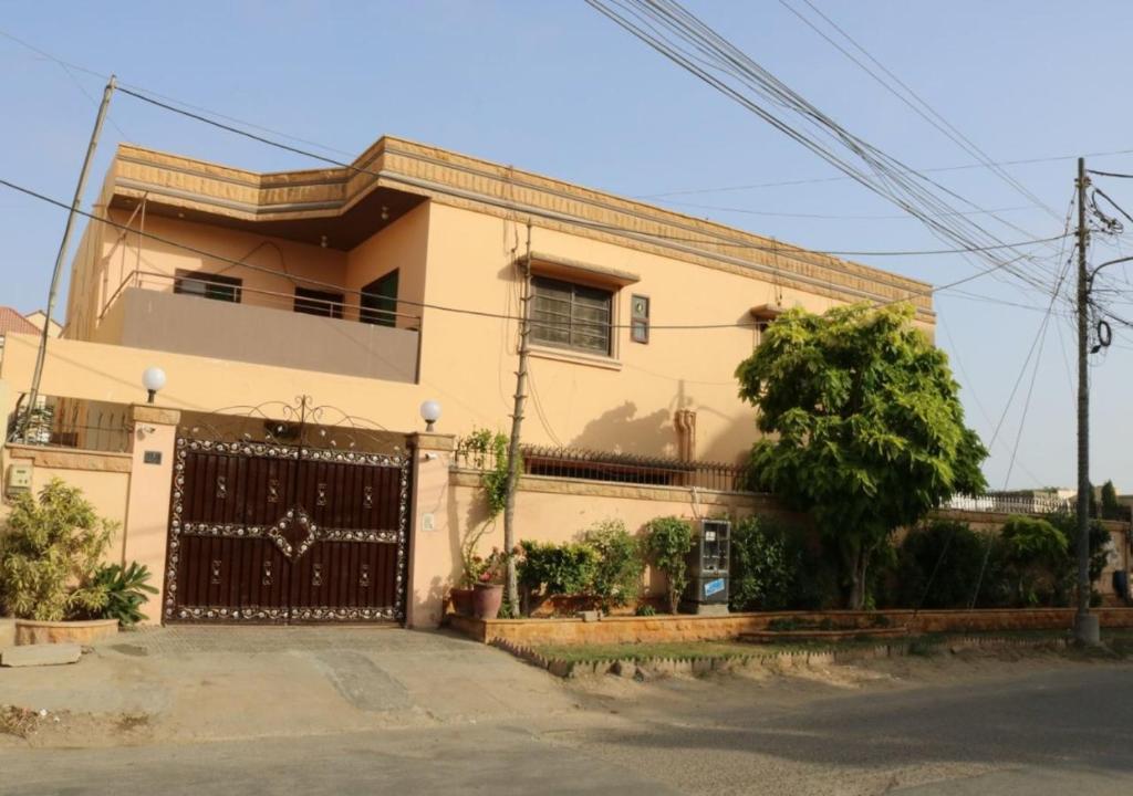 a house with a gate in front of it at Seaview Guest House in Karachi