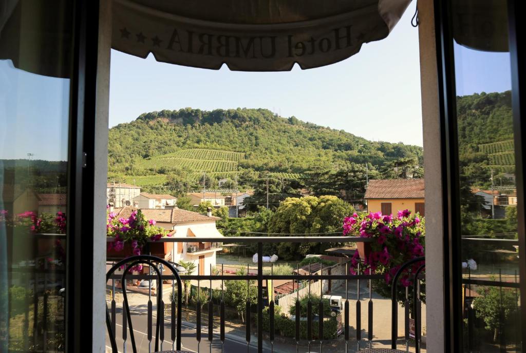 a view of a mountain from a window at Hotel Ristorante Umbria in Orvieto