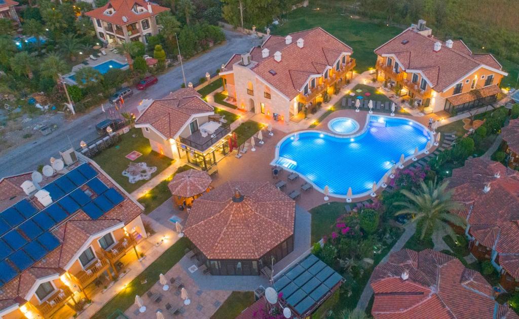 an aerial view of a house with a swimming pool at Dalyan Live Spa Hotel in Dalyan