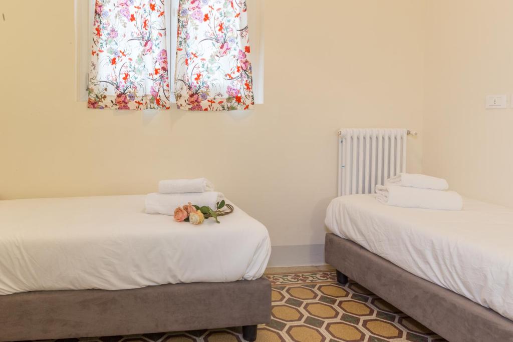 A bed or beds in a room at Pilastri Majestic Garden by Mmega