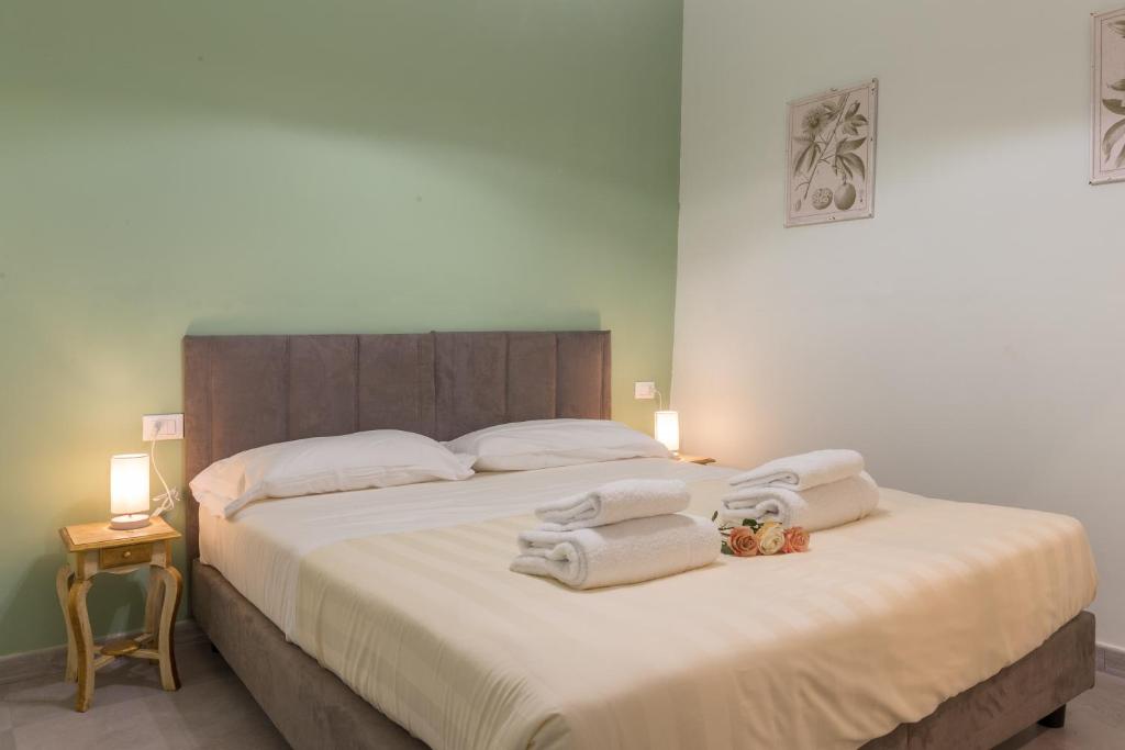 A bed or beds in a room at Pilastri Majestic Garden by Mmega