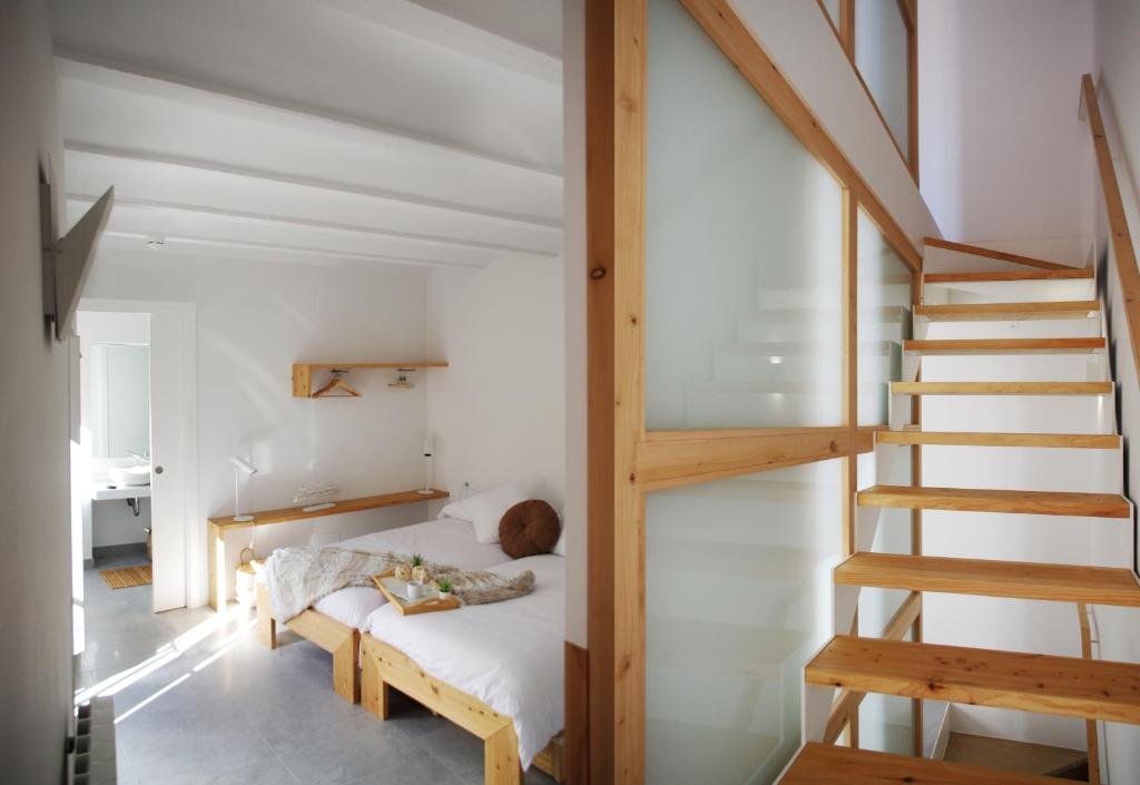 Postel nebo postele na pokoji v ubytování Can Girmas Casa de Turisme rural Navata