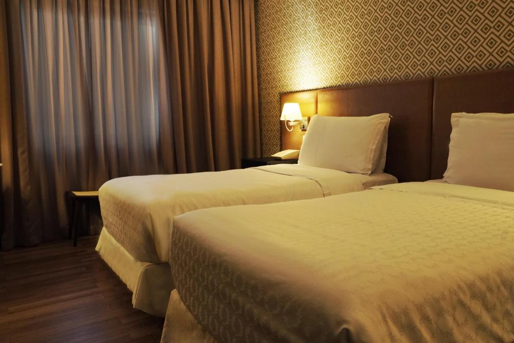 Postel nebo postele na pokoji v ubytování Wish Hotel da Bahia