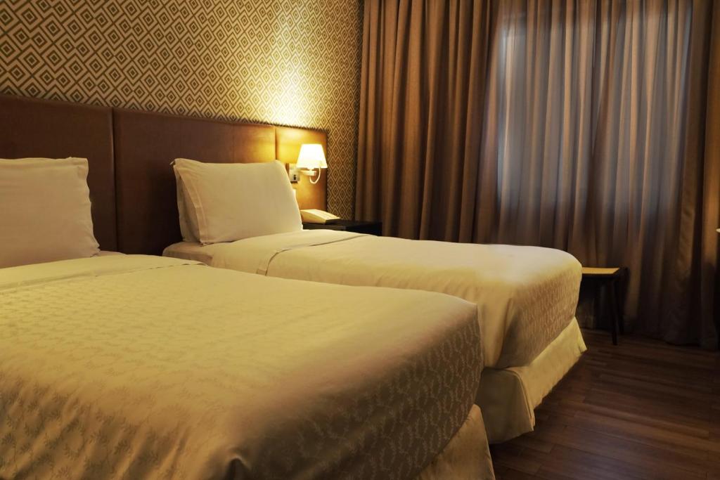 Postel nebo postele na pokoji v ubytování Wish Hotel da Bahia