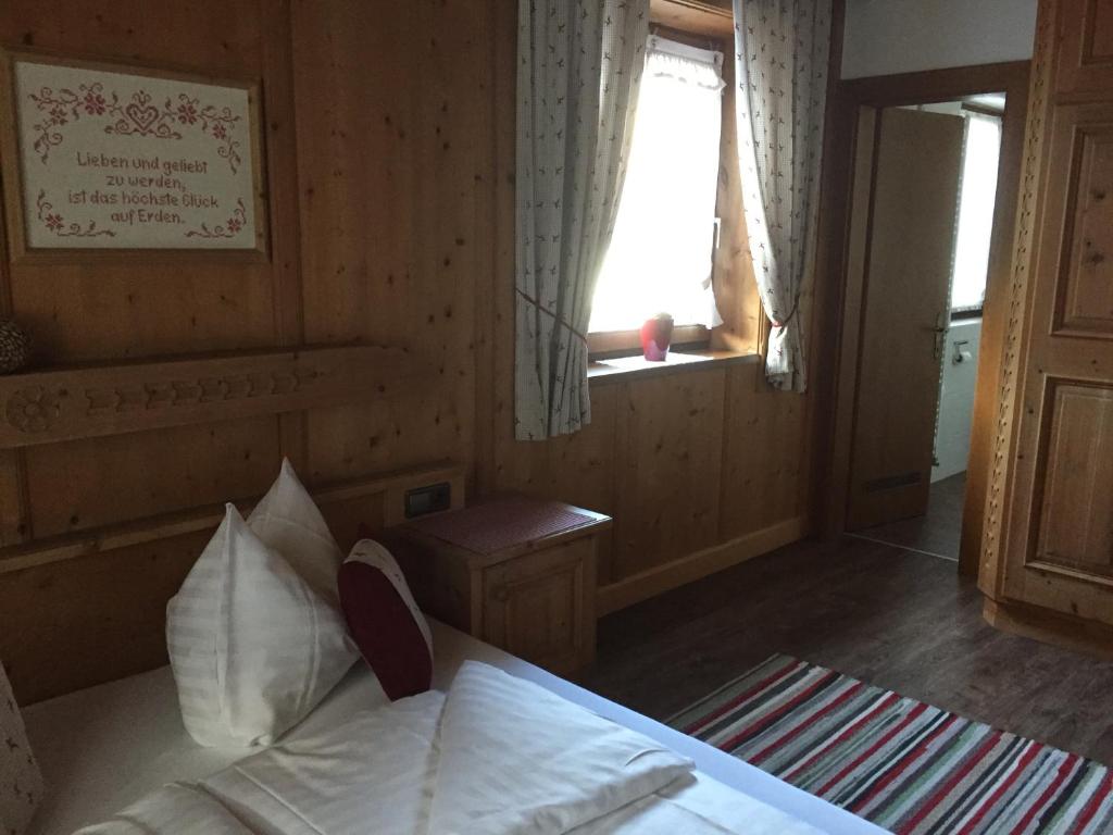 Postel nebo postele na pokoji v ubytování Das Enzian