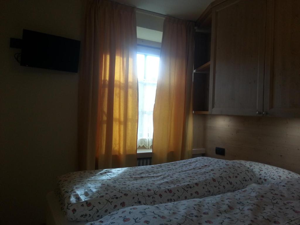 Postel nebo postele na pokoji v ubytování Chalet Del Sole per gruppi