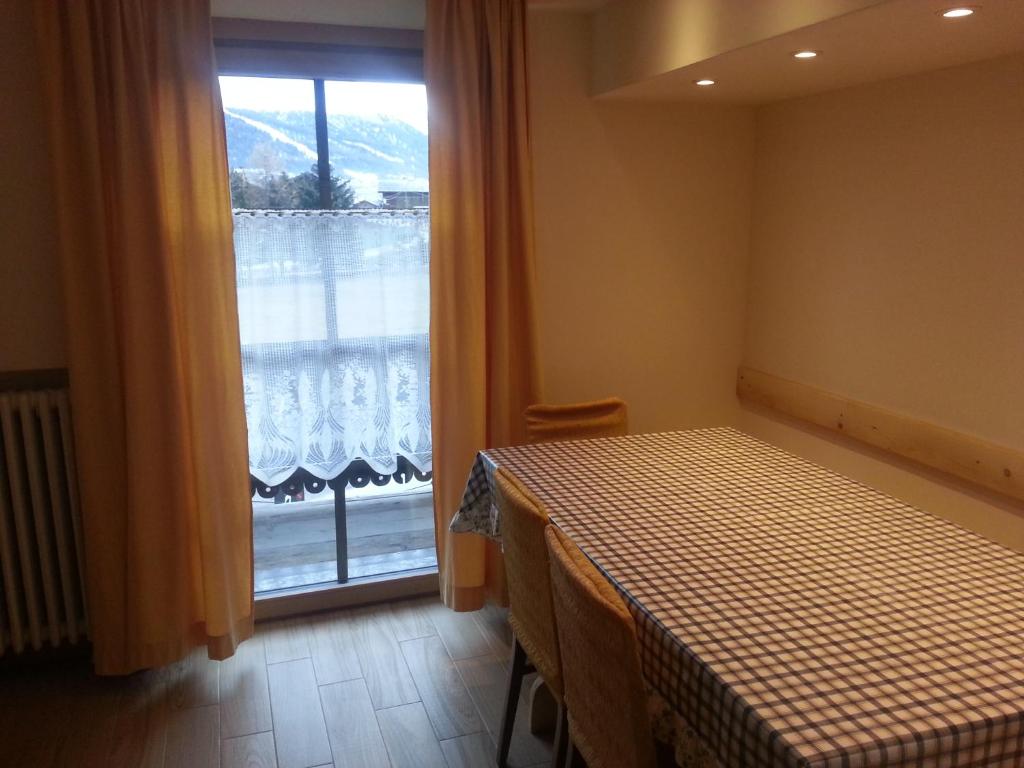 Postel nebo postele na pokoji v ubytování Chalet Del Sole per gruppi