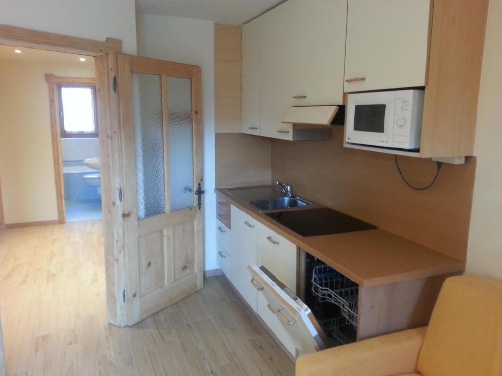 Kuchyň nebo kuchyňský kout v ubytování Chalet Del Sole per gruppi