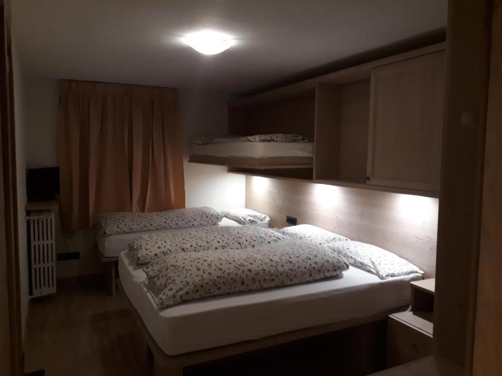 Postel nebo postele na pokoji v ubytování Chalet Del Sole per gruppi