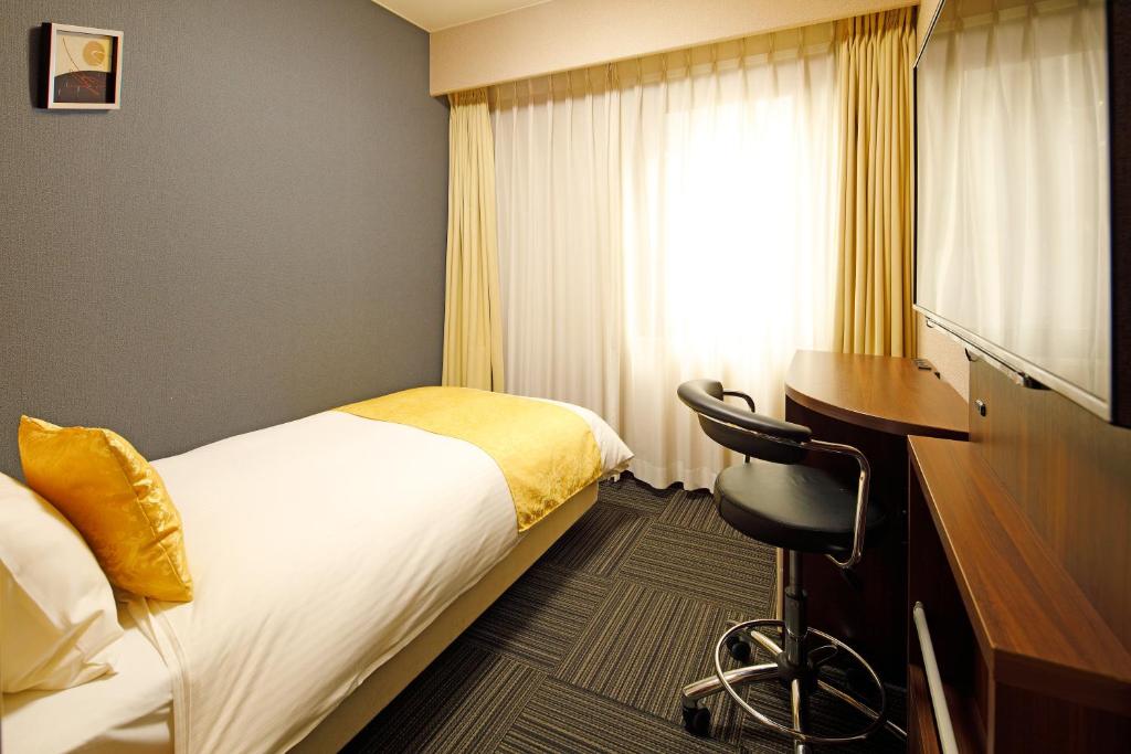 Postel nebo postele na pokoji v ubytování Hotel Sunroute Hikone