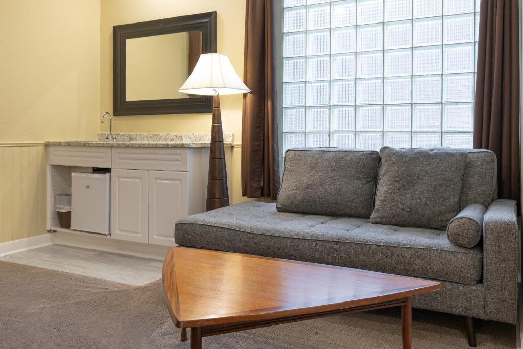 a living room with a couch and a table at Banff Boutique Inn - Adults only in Banff