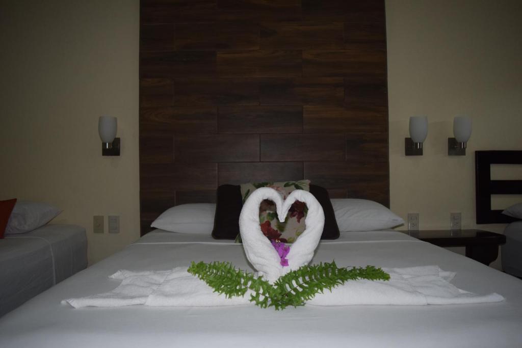 Postel nebo postele na pokoji v ubytování Hotel Tuparenda