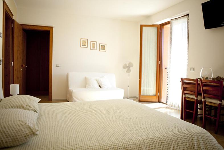 Postel nebo postele na pokoji v ubytování B&B Al Sole Di Cavessago