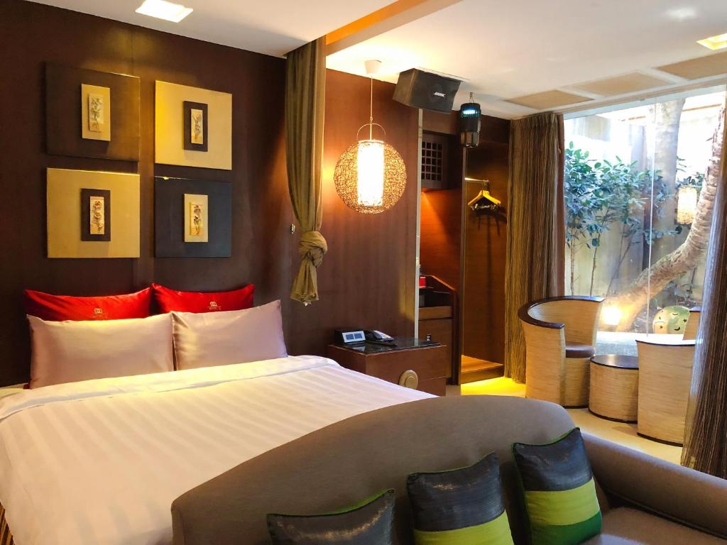 Postel nebo postele na pokoji v ubytování Q Motel精品旅館