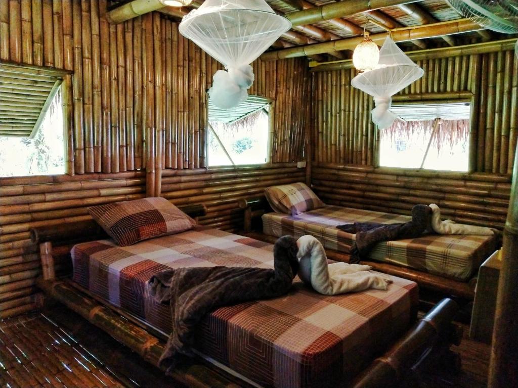 Postel nebo postele na pokoji v ubytování KRABI BAMBOO KINGDOM at AOLUEK PARADISE
