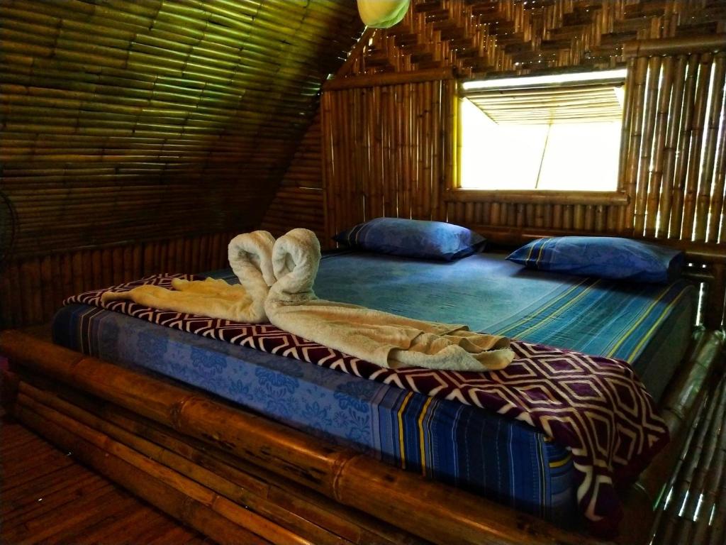 Postel nebo postele na pokoji v ubytování KRABI BAMBOO KINGDOM at AOLUEK PARADISE