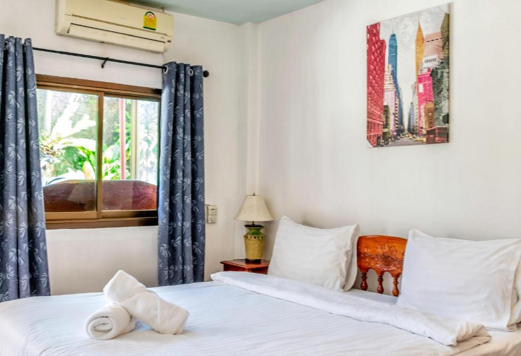 Postel nebo postele na pokoji v ubytování Kata Leaf Resort Phuket -