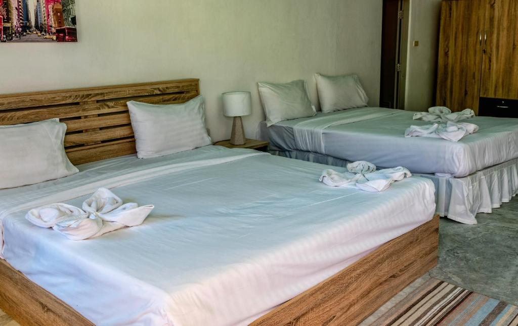 Postel nebo postele na pokoji v ubytování Kata Leaf Resort Phuket -