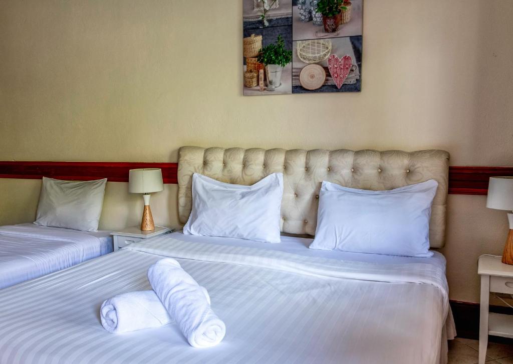 Postel nebo postele na pokoji v ubytování Kata Leaf Resort Phuket -