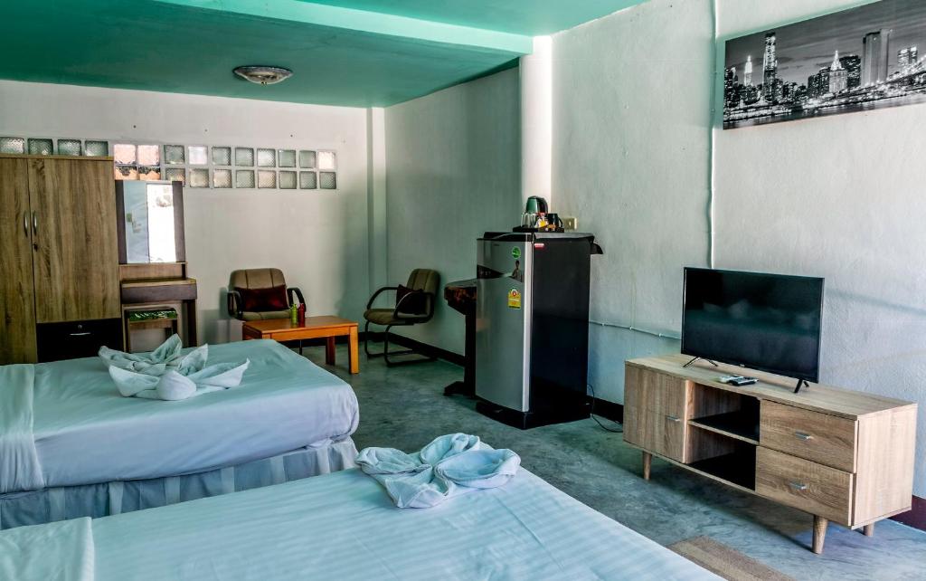 Postel nebo postele na pokoji v ubytování Kata Leaf Resort Phuket -
