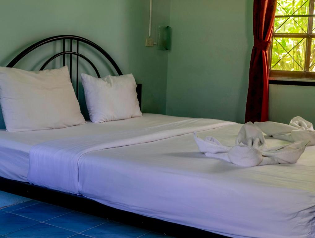 Postel nebo postele na pokoji v ubytování Kata Leaf Resort Phuket -