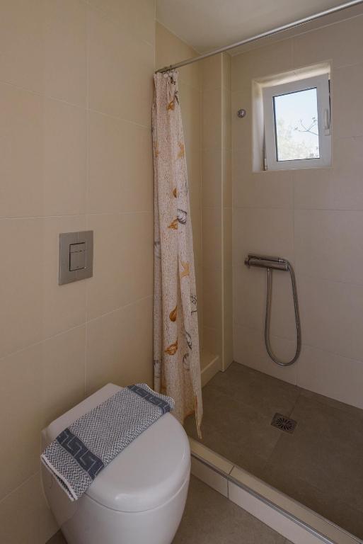 Koupelna v ubytování Poseidon Studios & Apartments