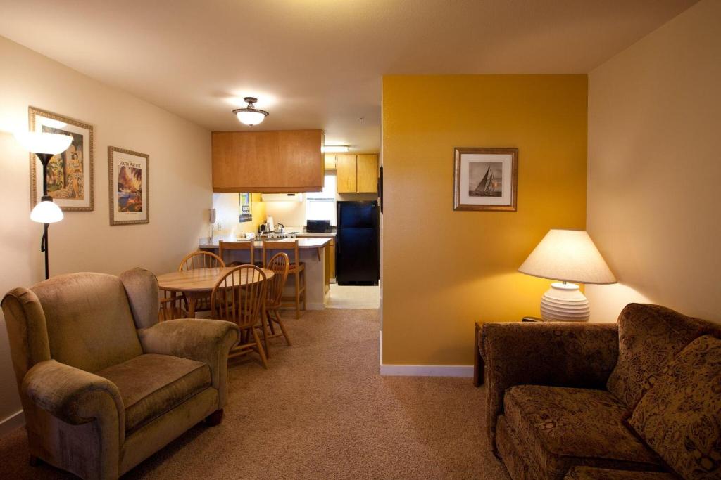 a living room with a couch and a table and chairs at 09 Lodge in Hood River