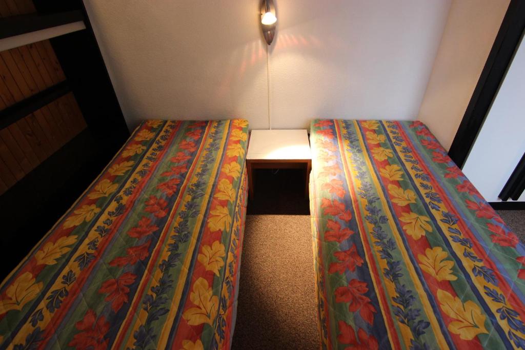 Postel nebo postele na pokoji v ubytování Olympic Appartements VTI