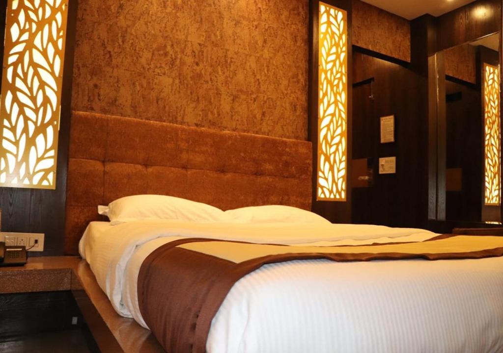 Postel nebo postele na pokoji v ubytování Hotel Angina