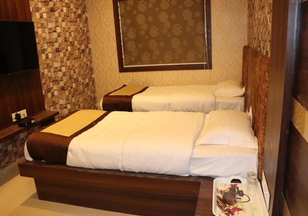 Postel nebo postele na pokoji v ubytování Hotel Angina