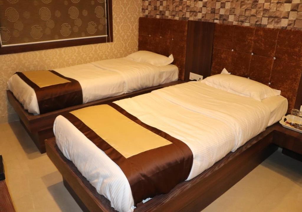 Postel nebo postele na pokoji v ubytování Hotel Angina