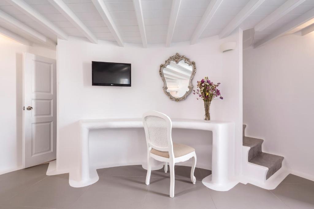 A television and/or entertainment centre at Absolute Mykonos Suites & More
