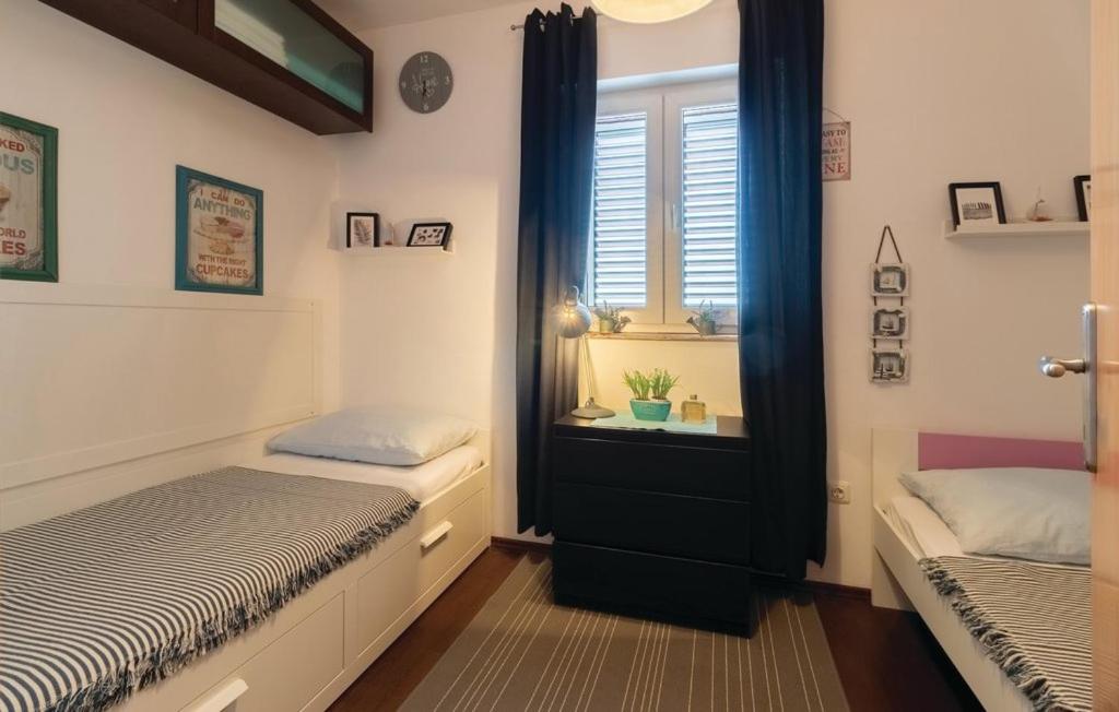 Postel nebo postele na pokoji v ubytování Apartments Jelavić