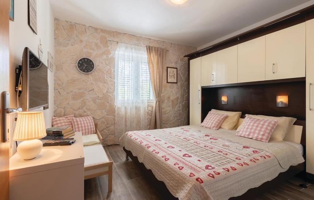 Postel nebo postele na pokoji v ubytování Apartments Jelavić