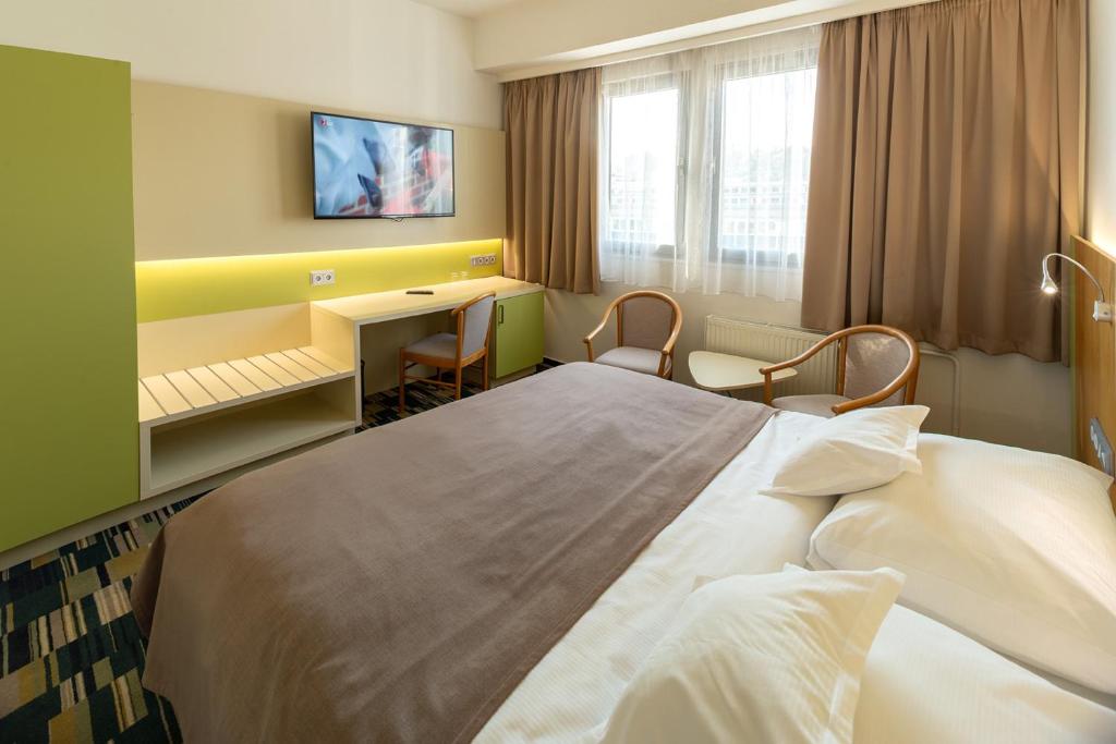 Postel nebo postele na pokoji v ubytování Hotel Continental