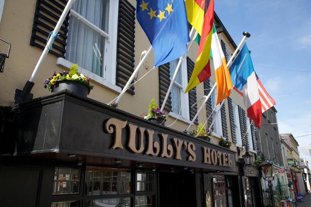 a building with a flag on the front of it at Tully's Hotel in Castlerea