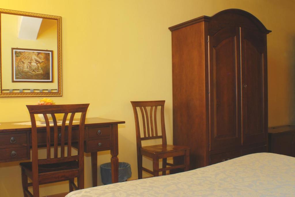Postel nebo postele na pokoji v ubytování B&B Triskèles
