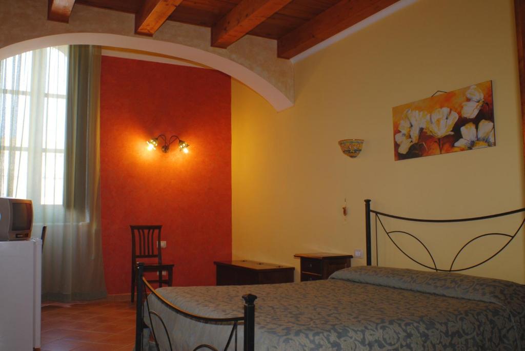Postel nebo postele na pokoji v ubytování B&B Triskèles